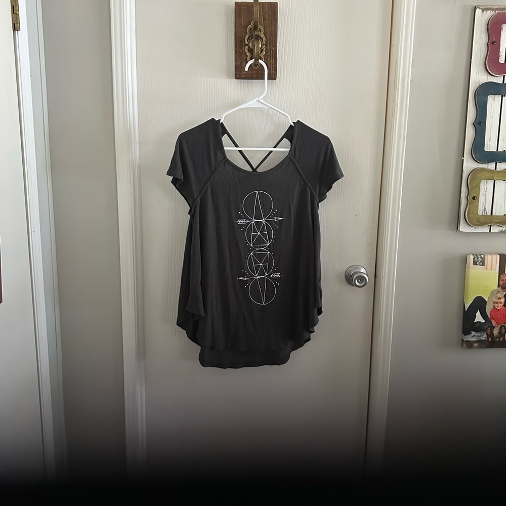 American Eagle black T-Shirt cross cross back. Good condition.